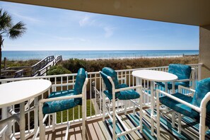 Balcony view - Outside the living area is this serene picture of beach beauty. A great place to unwind from a busy day while watching the sun set. The resort's boardwalk seen here provides access to the beach over the dune.