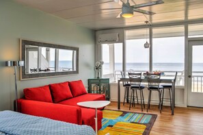 Dine with a view at this charming table set in front of floor-to-ceiling windows