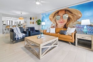 Open layout with cozy seating, beachy touches, and a view that brings the outside in.
