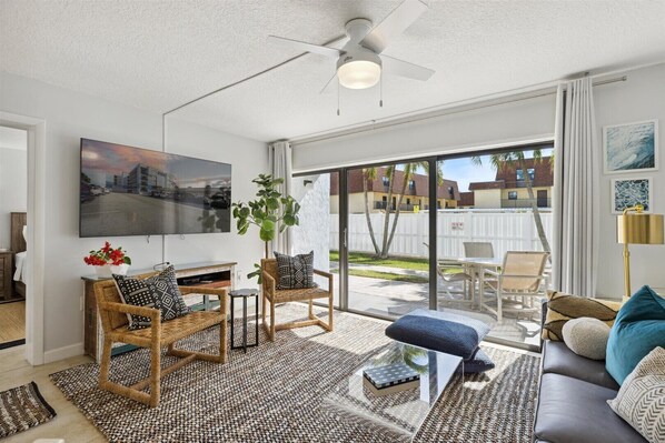 Kick back in this breezy retreat! Stream on the big TV, lounge on the sofa, or dine alfresco on the patio!
