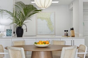 Bright, airy, and inviting! Gather around for fresh bites, good vibes, and sunny mornings in this stylish space.