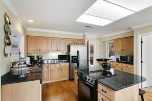 Updated Kitchen with Stainless Appliances & Granite Countertops - opens to breakfast area and dining room