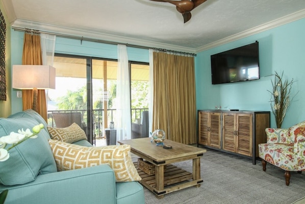 Huge fifty inch flat screen TV in this designer decorated living area w/ balcony views