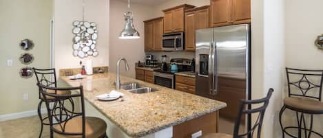 Modern Kitchen w/Stainless Steel Appliances & Granite Counter Tops