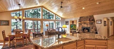 Get everyone together and cook a meal to share in this spacious 4 bedroom forest home!