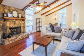 You'll love the gorgeous floors and wood beamed ceiling in the Oak Woods Cottage living room and dining room.
