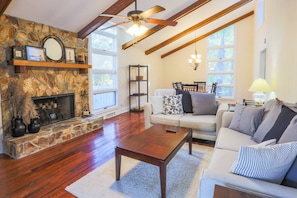 You'll love the gorgeous floors and wood beamed ceiling in the Oak Woods Cottage living room and dining room.