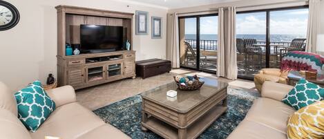 Spacious family room with views that will take your breath away. - The living area is a great place for entertaining or relaxing. Glass doors lead directly to the 30' private balcony overlooking the beach.