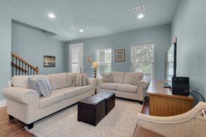 Open-concept living area with sleeper sofa, plenty of space for a large family