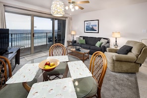 Beach front living room - Beach front living room. The sofa pulls out to be a queen sleeper. Outstanding views from the living room, dining and kitchen areas! 5th floor is the way to go!