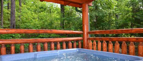 Relax and Unwind in the private Hot Tub at Kozy Lodge