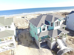 Looking east aerial photo. - This aerial photo was taken before the tiki bar and front porch extension, but does show how close the ATLANTIC ocean is..  steps away!.