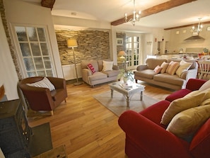 A comfy lounge with wood-burner