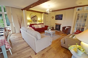 The open plan living area with wood-burner