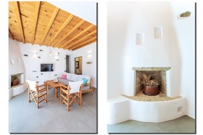 Cozy living room with a sofa bed and a decorative traditional fireplace