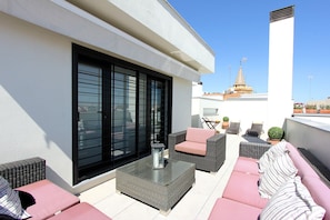 Terrace with garden furniture.