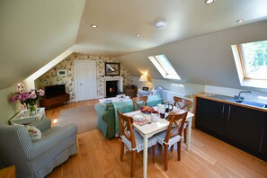 The open plan sitting room and kitchen