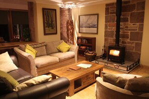 Sitting area  can be nice and cosy with the log fire