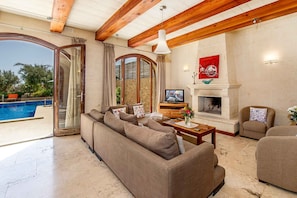 Living room with wood-burning fireplace