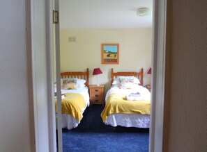 The twin bedroom leads off the dining/activities room