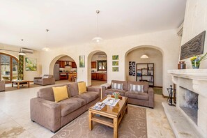 Living room of Gozo Villa with fireplace
