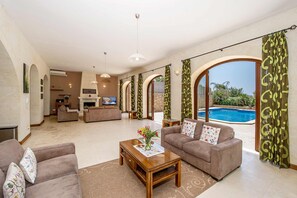 Living room area of luxury Gozo villa with pool
