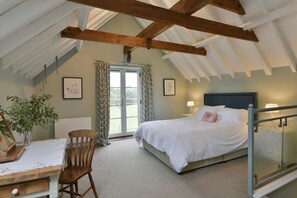 Lodge Farm, Freston: Master bedroom with king-size bed in The Parlour