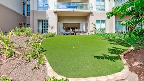 Large lawn area is perfect for kids to play after enjoying the pools. 