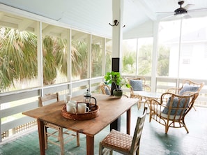 The screened in porch captures all the ocean breezes you'll need.