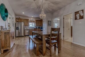 Dining Area - The kitchen and dining area is oh so spacious and offers plenty of seating for every member of your group. Lots of memories can be made here!!!