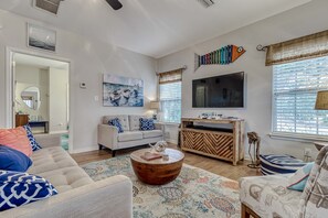 Living Area - The living area offers a sofa, loveseat and a cozy side chair. The coastal décor makes you feel right at home!