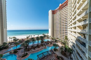 Largest pool in Panama City Beach!  This incredible beachfront pool complex has a lagoon pool, a huge hot tub, a tiki bar and a snack bar!  Check out the Virtual Tour of this property on our listing.  Tropical pool deck, paradise!