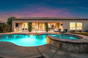 Backyard oasis with a pool and hot tub.