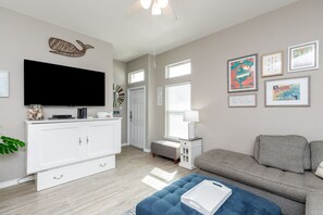 Spacious living area with queen size credenza and flat screen TV