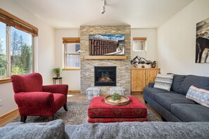 Large couch with views & flat screen TV