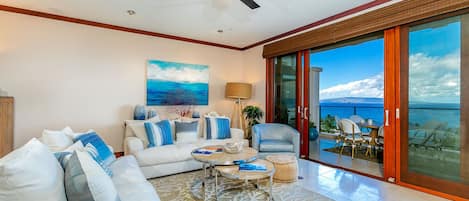 Floor to ceiling pocket doors with ocean views from sofa