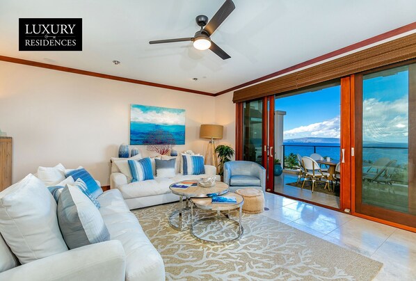 Floor to ceiling pocket doors with ocean views from sofa