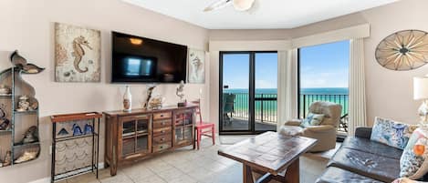 Spacious Living Room with a Sleeper Sofa and Balcony Access