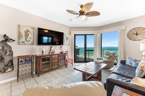 Spacious Living Room with a Sleeper Sofa and Balcony Access