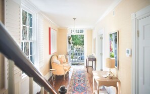 The entryway to the main home, featuring the home's original gorgeous floors.