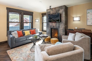 Warm up by the fire and catch the game on the flat screen TV