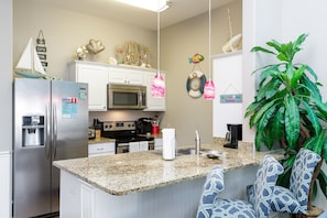 Breakfast bar, seating for three with beautiful counter tops