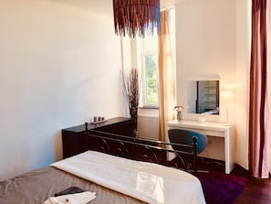 Main bedroom with super king size bed, plenty of storage dressing table, terrace