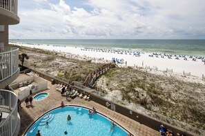 Balcony views of the pool deck and beach access