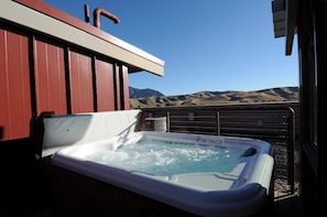 Enjoy the hot tub on the roof for soaking under the stars.