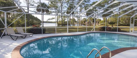 Screened in large pool with lake view