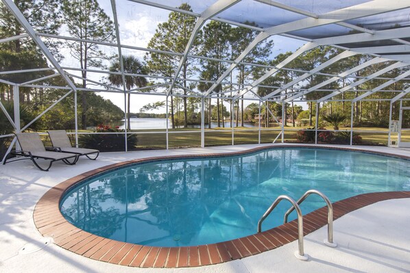 Screened in large pool with lake view