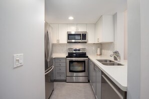Fully equipped kitchen with stainless steel appliances