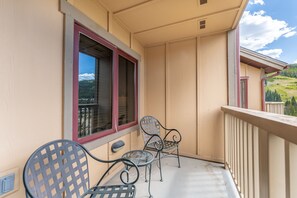 Private balcony with outdoor seating and incredible alpine views.