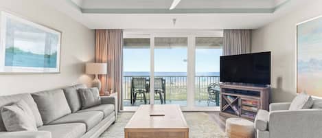 Ocean Song 332 - Living area with stunning views and balcony overlooking the beach